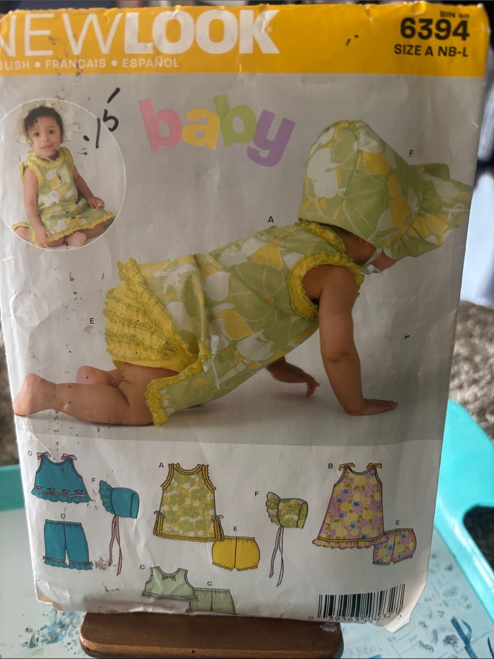 New Look sewing pattern featuring designs for a top, pants, and a bonnet.